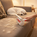 WagNestra Lint Roller being rolled across a fur-covered sofa